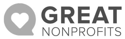Logo for Great Nonprofits featuring a speech bubble with a heart inside, followed by the words GREAT NONPROFITS in bold, uppercase letters.