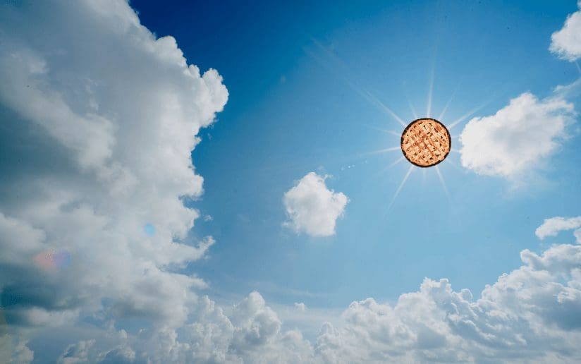 Pie in the sky with sun rays and clouds. Metaphor for high expectations.
