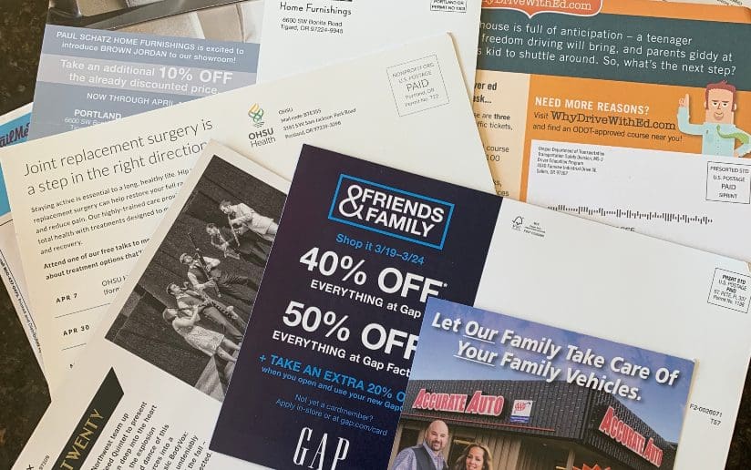 Pile of direct marketing mailers from local businesses and healthcare providers. Mindful marketing.