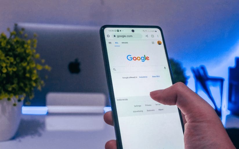 Google search on a smartphone screen. "Google" logo visible. Marketers use Google for recommendations.