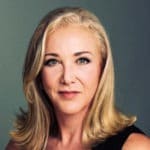 Blonde woman with blue eyes looking at the camera