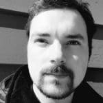 Man with goatee looking at the camera, black and white portrait