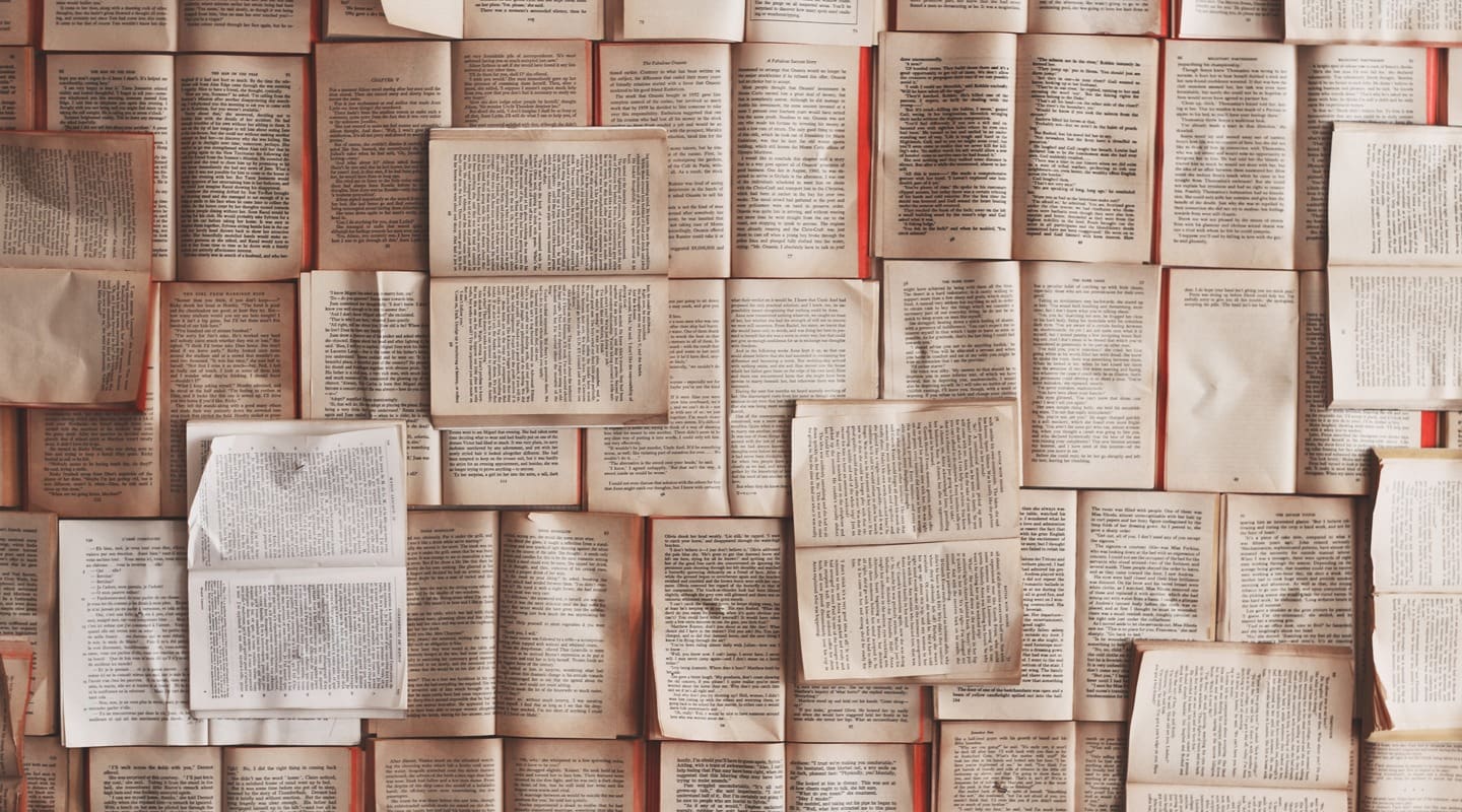 Open books arranged, representing content and reading for brand promotion.