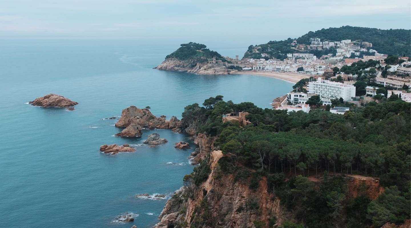 Scenic coastal town with cliffs, sea, and buildings. A beautiful view.