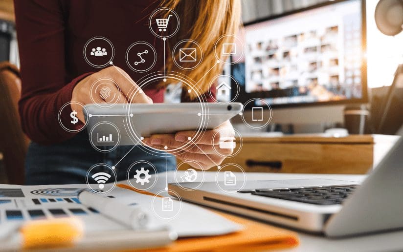 Digital marketing: Woman using tablet with icons representing online business tools.