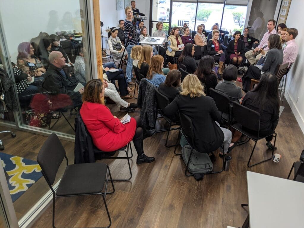 EM specialists gather for a community meeting at Open Canopy.