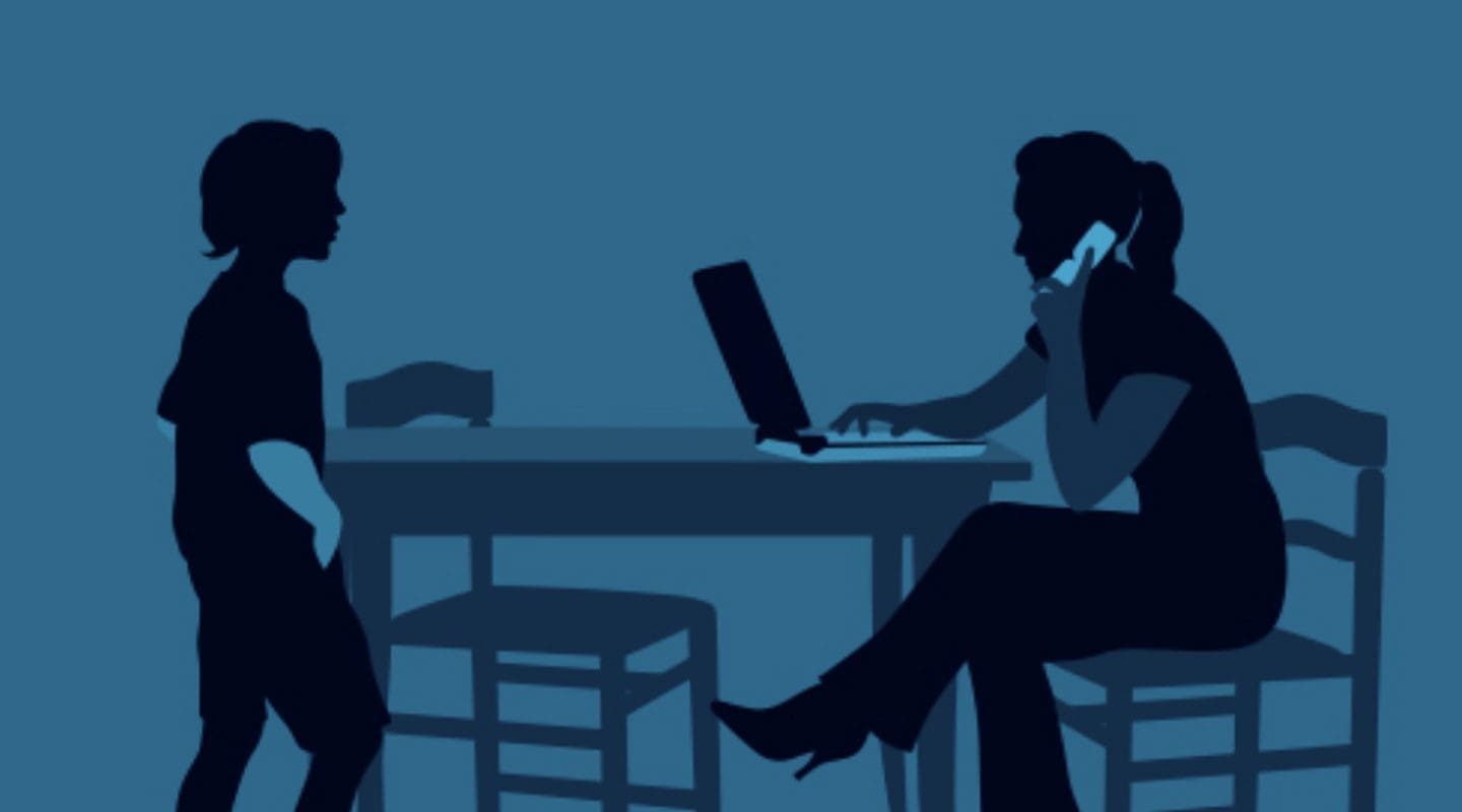 Silhouette of a woman working from home on a laptop while talking on the phone, with a child standing nearby.