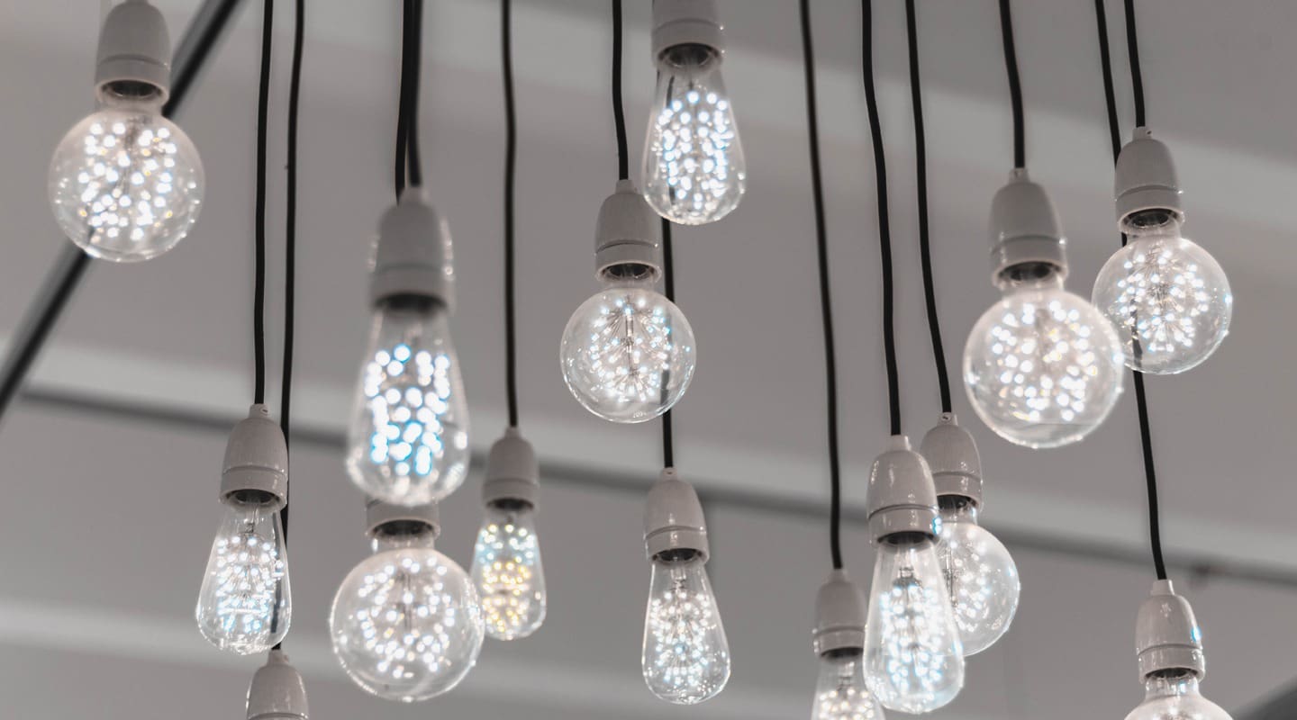 Decorative light bulbs hanging from the ceiling, creating a modern lighting design.