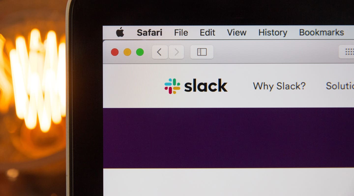 Slack website open in Safari browser on a laptop