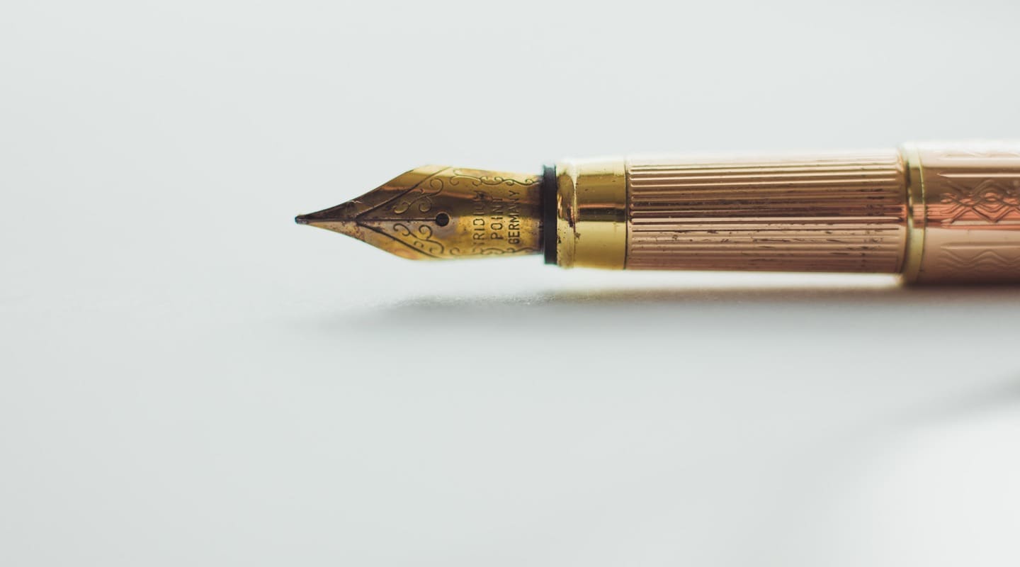 Close-up of a gold fountain pen, perfect for writing a great blog post.