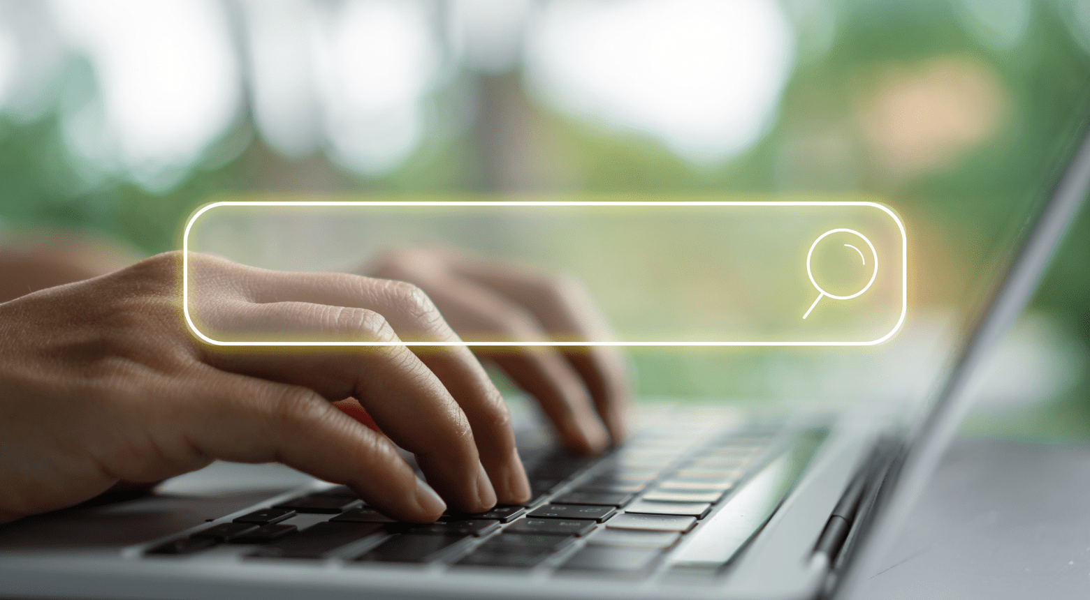 Person typing on laptop with a search bar overlay; adapting SEO as AI changes search